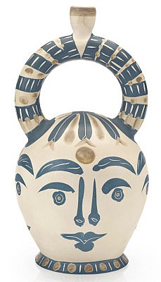 Picasso four aztec faces white ceramic pitcher with blue marking.